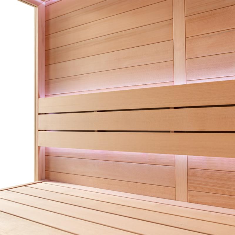 Innenraum der AWT E1602C Hemlock Sauna mit Holzbänken, rosa Beleuchtung und hellen Holzwänden, Platz für 3 Personen