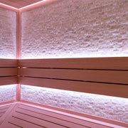 EAGO AWT E1603C Infrarot-Sauna Innenansicht mit Holzbänken, rosa LED-Beleuchtung und Ziegelmauer-Design