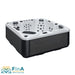 FinA Xaluna Outdoor Whirlpool für 5 Personen mit grauer Seitenverkleidung und weißer Acrylwanne, ausgestattet mit zahlreichen Massagedüsen und Kopfstützen.