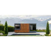 Genevas Zürich Modular Sauna mit Holzfassade in modernem Design, aufgestellt in Seegarten mit Bergblick