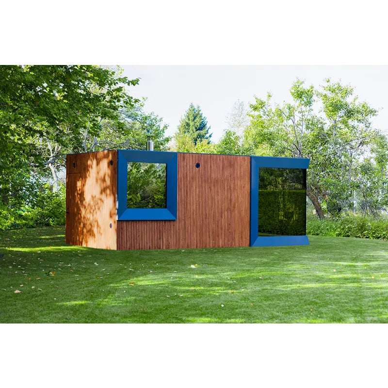 Genevas Zürich Modular Sauna mit blauem Rahmen und holzverkleideter Fassade im Garten