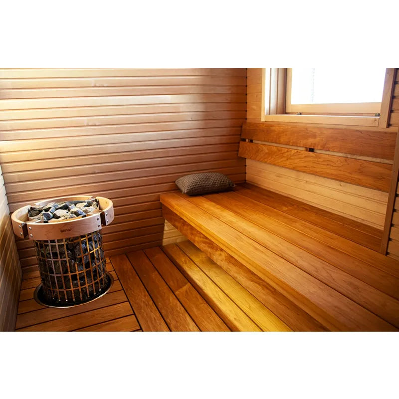 Harvia Cilindro Elektro Saunaofen in moderner Holzsauna mit Liege und Harvia Saunaofen