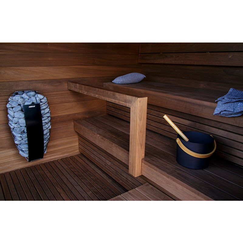 Harvia Spirit Sauna heater with sauna stones - integrated in an elegant wooden sauna, with sauna bucket and ladle as accessories