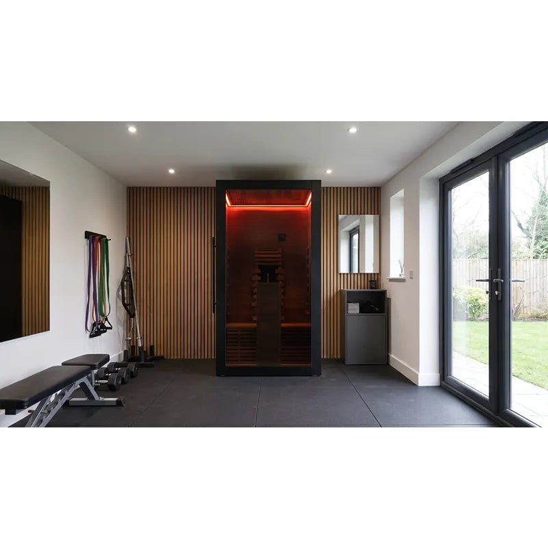 Hekla IR 100 Infrarotsauna 100x120 mit roter Beleuchtung in modernem Wellness-Raum integriert