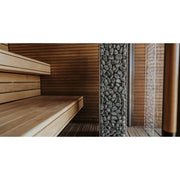 Huum Cliff elektronischer Saunaofen im Inneren einer modernen Sauna mit Holzbänken und Steinofen