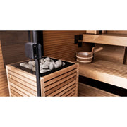 Huum Core Black Saunaofen Standofen mit Saunasteinen in moderner Holzsauna-Inneneinrichtung