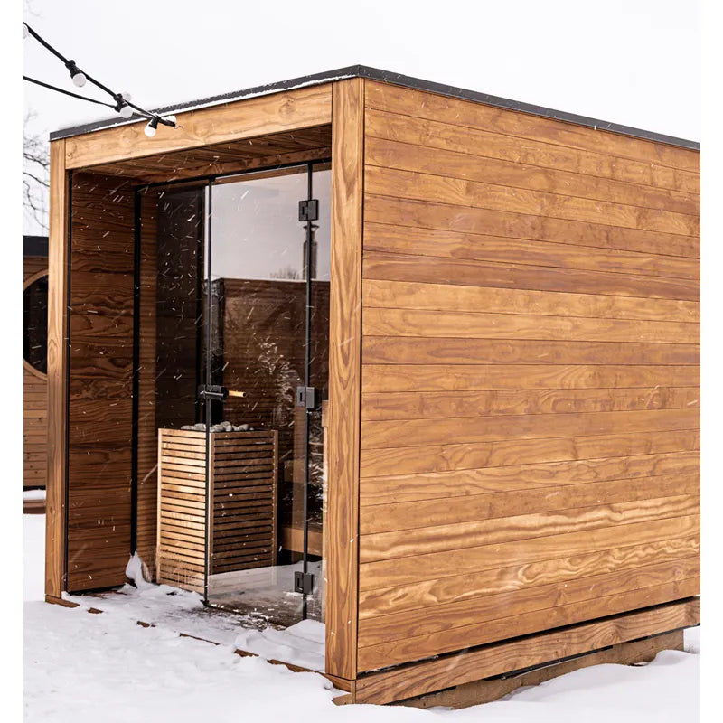 Huum Core Black Saunaofen 6/9/10.5 kW Standofen in moderner Gartensauna aus Holz mit Glastür