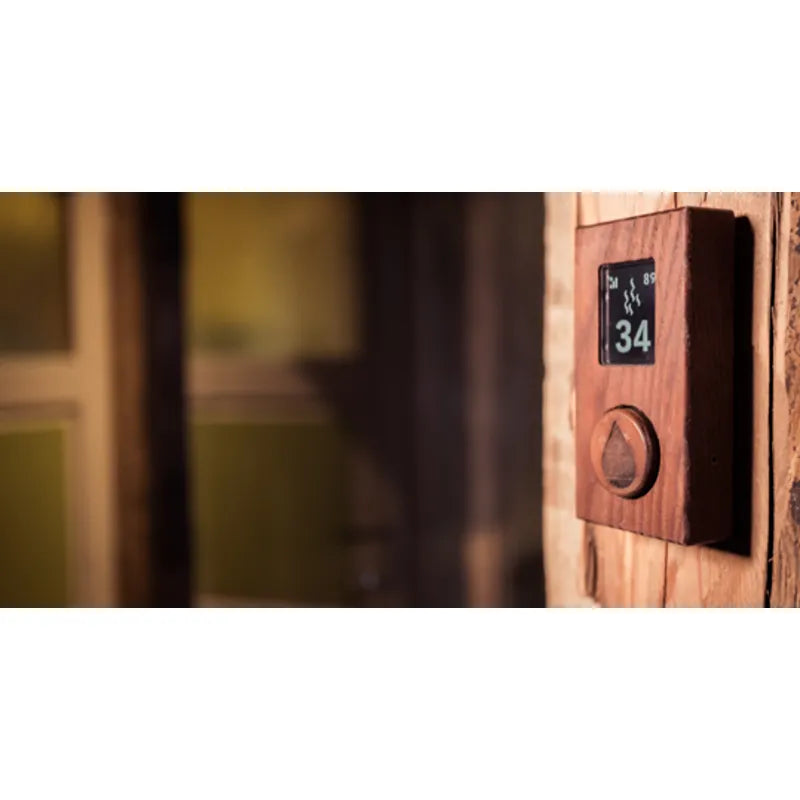 Huum Core Wall Mini elektrischer Saunaofen Wandofen mit digitaler Steuerung an Holzwand montiert