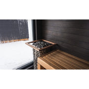 HUUM Elektrischer Saunaofen STEEL mit Saunasteine und Holzbank in moderner Sauna