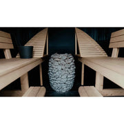 Huum Hive elektrischer Saunaofen 12/15/18 kW Standofen mit Steinen in moderner Sauna mit Holzbänken