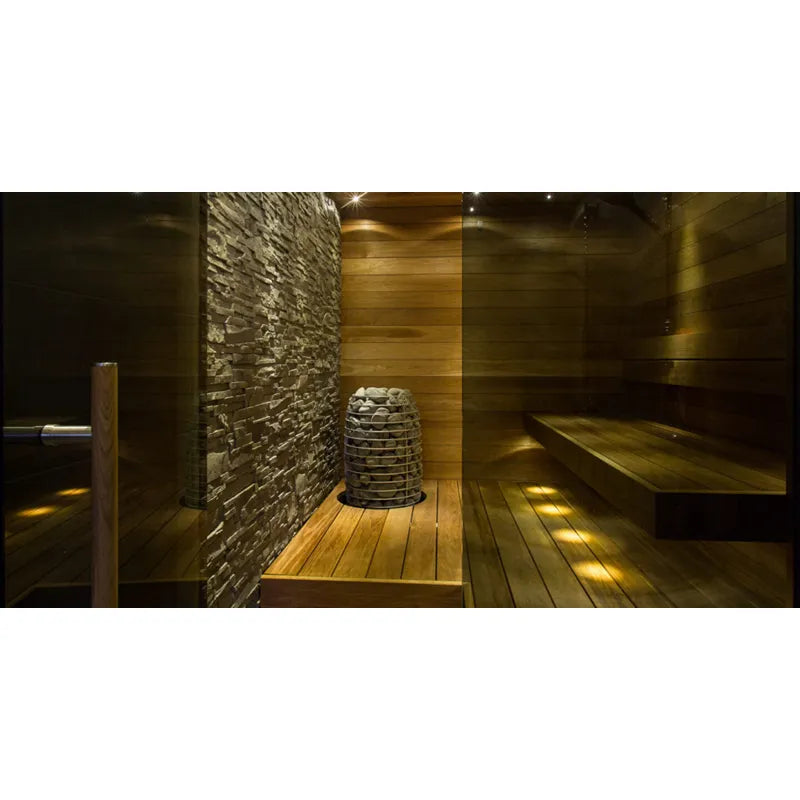 Huum Hive Mini elektrischer Saunaofen in moderner Sauna mit Holzbank und Steinwand