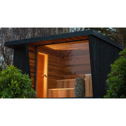 Huum Hive Mini elektrischer Saunaofen in moderner schwarzer Gartensauna mit Holzinnenausstattung und Steinofen