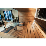Huum Hive Mini elektrischer Saunaofen 6/9/10.5 kW Standofen in moderner Wellness-Sauna mit Holzbänken