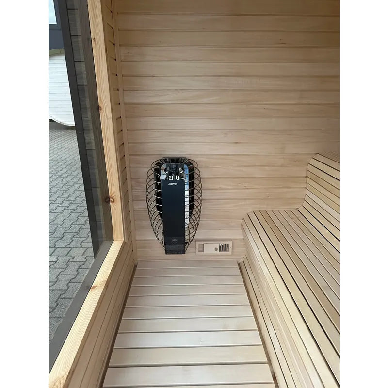 KOBA Cube Gartensauna Innenraum mit Saunaofen und Holzbänken