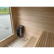 KOBA Cube Gartensauna Innenraum mit Holzbänken und Saunaofen