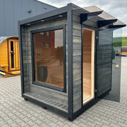 KOBA Cube Gartensauna - Moderne quadratische Form mit anthrazitem Rahmen, großem Fenster und Holzinnenausstattung