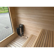 KOBA Cube Gartensauna Innenraum mit Holzbänken und Saunaofen