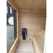 KOBA Cube Gartensauna Innenraum mit Holzbänken, Heizstrahler und Kontrollelement