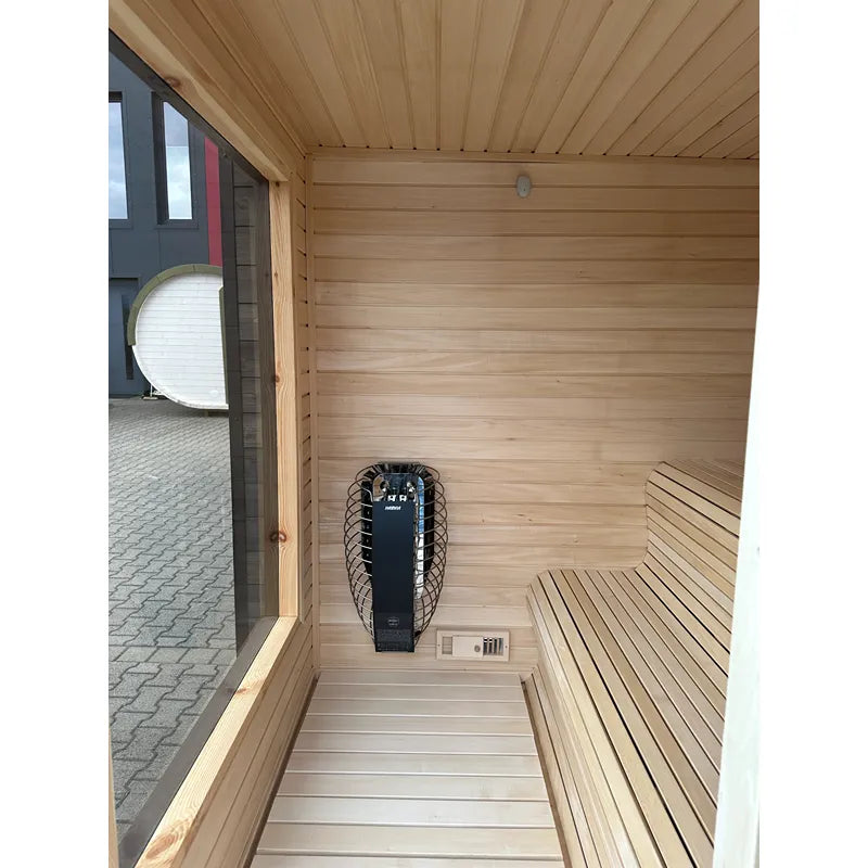 KOBA Cube Gartensauna Innenraum mit Holzbänken, Heizstrahler und Kontrollelement