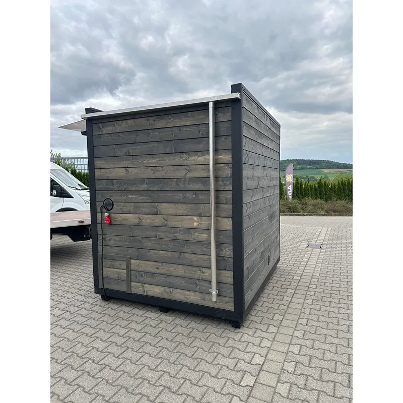 KOBA Cube Gartensauna - Moderne quadratische Form mit anthrazitgrauer Holzfassade im Garten