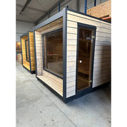 KOBA Cube Gartensauna - Moderne quadratische Form mit Holzverkleidung und großem Fenster in Lagerhalle