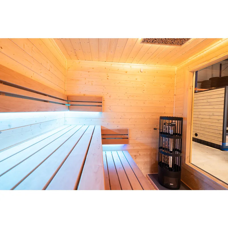 KOBA Cube Gartensauna Innenraum mit Holzbänken und modernem Saunaofen