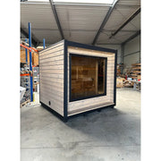 KOBA Cube Gartensauna - Moderne quadratische Form mit Holzverkleidung und großem Panoramafenster in Werkstatt