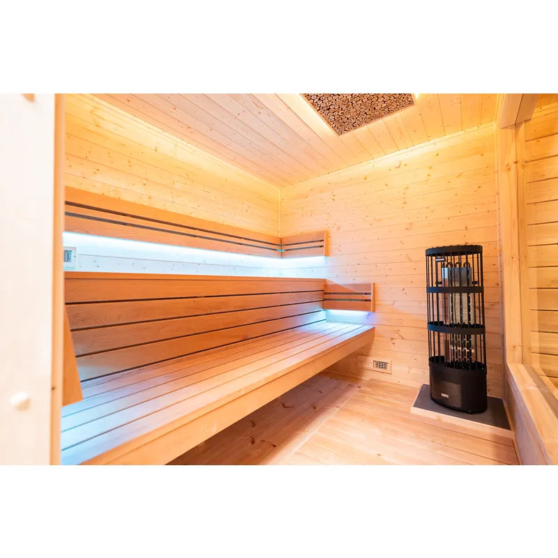 KOBA Cube Gartensauna Innenraum mit Holzbänken und Saunaofen