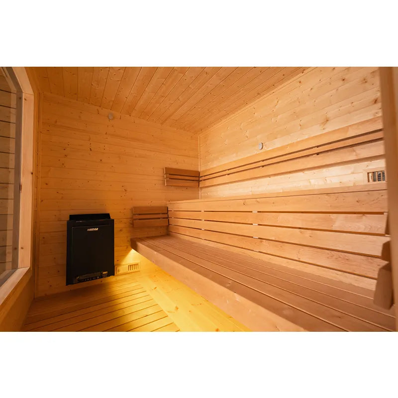KOBA Cube Gartensauna Innenraum mit Holzbänken und Saunaofen