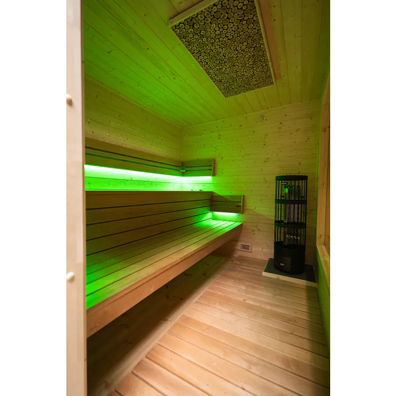 KOBA Cube Gartensauna Innenraum mit Holzbänken und grüner LED-Beleuchtung
