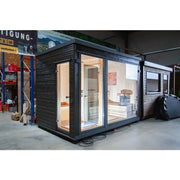 KOBA Fenris Gartensauna - Designsauna mit schwarzem Außenrahmen und heller Holzausstattung innen, großflächige Glastüren