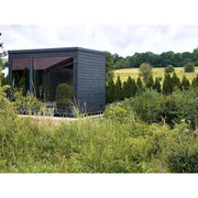 KOBA Fenris Gartensauna - Designsauna mit schwarzer Holzverkleidung im grünen Garten