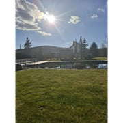 KOBA Fenris Gartensauna - Designsauna in moderner Gartenlandschaft mit Pool und Bergblick