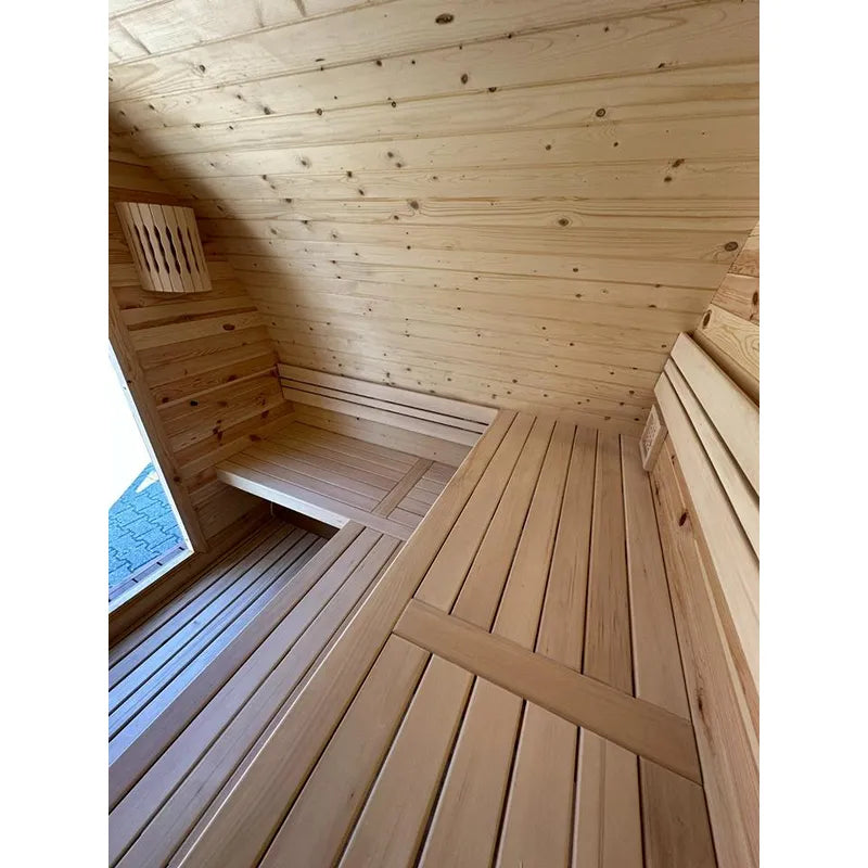 KOBA Iglu Gartensauna Innenraum mit Holzbänken und gewölbter Holzdecke
