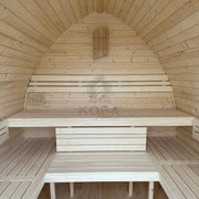 KOBA Iglu Gartensauna Innenraum mit charakteristischer Iglu-Form, Holzbänken und Saunaofen