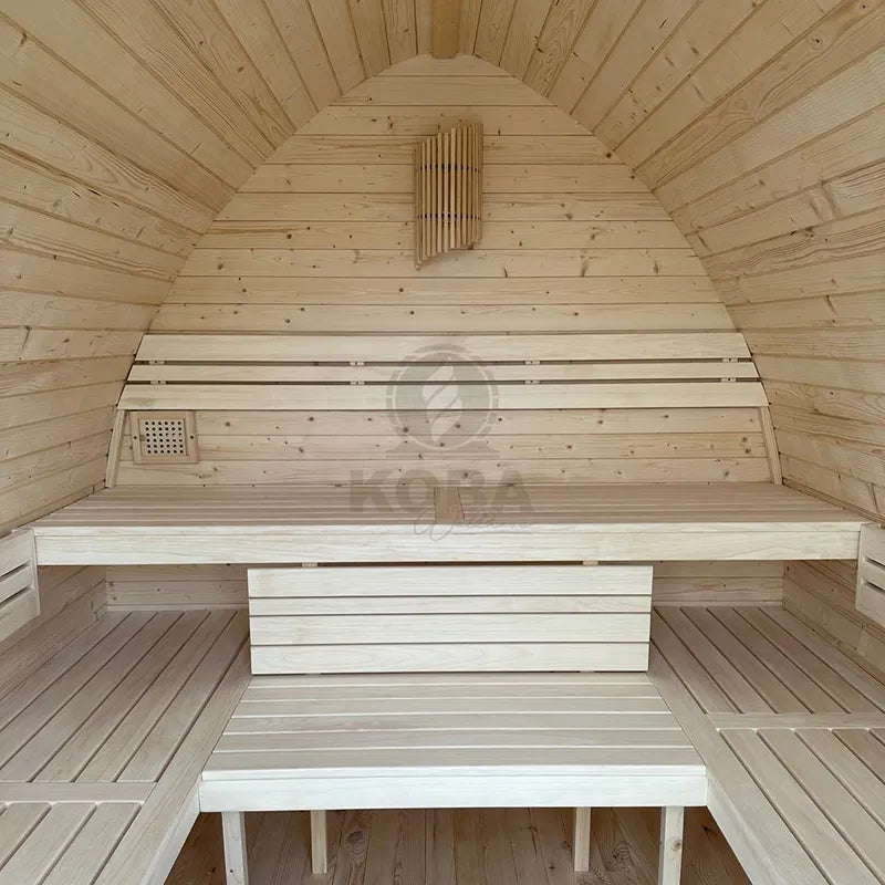 KOBA Iglu Gartensauna Innenraum mit charakteristischer Iglu-Form, Holzbänken und Saunaofen