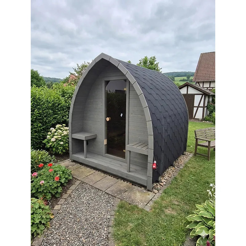 KOBA Iglu Gartensauna - Besondere Iglu-Form mit grauer Holzverkleidung und schwarzem Dach im Garten
