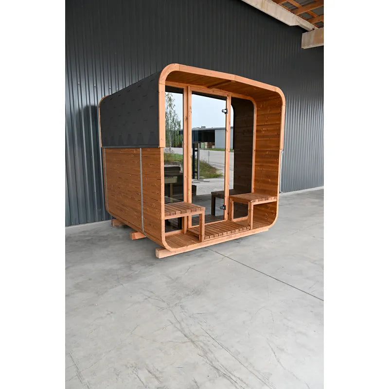 KOBA Lignotherm Quadro DIY Gartensauna mit Holzverkleidung, schwarzem Dach und großen Glastüren auf Betonplatz