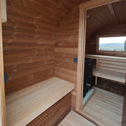 KOBA Quadro Gartensauna Innenraum mit Holzbänken und Saunaofen
