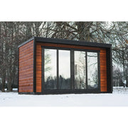 Leil® Patio L Gartensauna von Leil® Saunas mit Holzverkleidung und großen Glasfenstern im verschneiten Garten