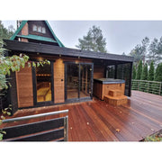 Leil Patio L Plus Gartensauna mit Überdachung, Holzsauna mit schwarzem Dach auf Terrasse neben Whirlpool