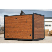 Leil Patio M Gartensauna von Leil Saunas mit Holzverkleidung und schwarzem Rahmen in Außenansicht