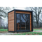 Leil® Patio XS Gartensauna von Leil® Saunas mit Holzverkleidung und großen Glasfenstern im Garten