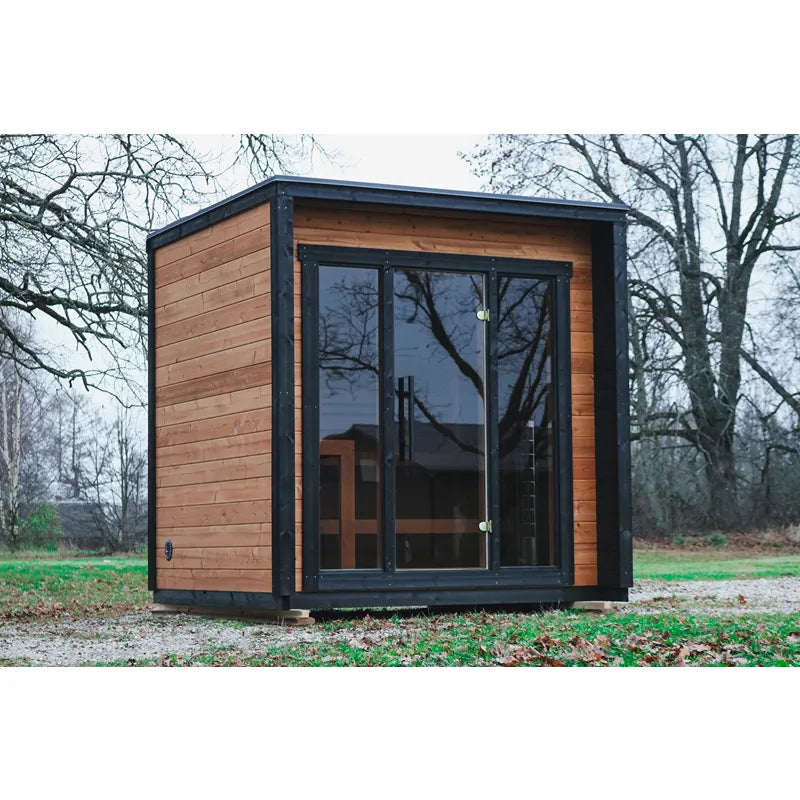 Leil® Patio XS Gartensauna von Leil® Saunas mit Holzverkleidung und großen Glasfenstern im Garten