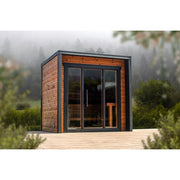 Leil® Patio XS Gartensauna 4 Personen 4,9 m² von Leil® Saunas mit Holzfassade und großer Glasfront in Waldumgebung