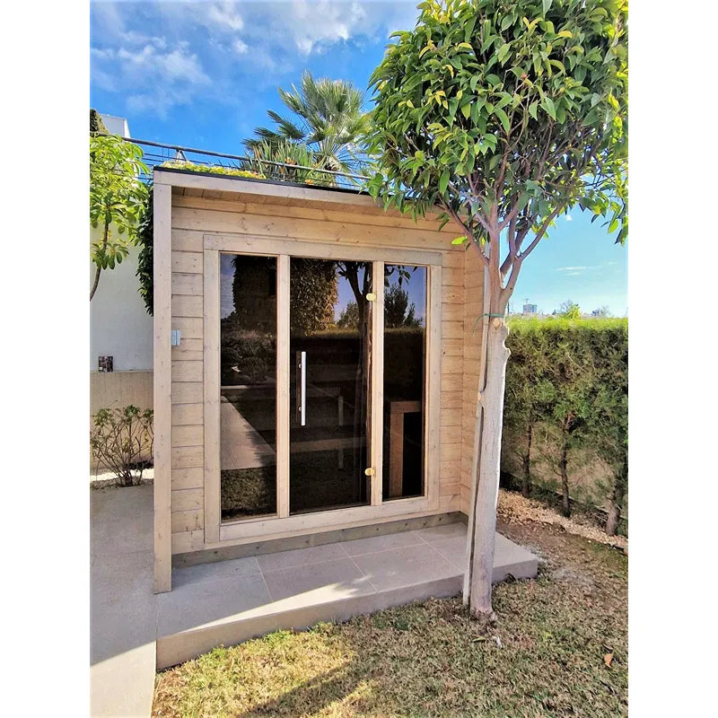 Leil® Patio XS Gartensauna 4 Personen von Leil® Saunas mit Holzfassade und großem Glasfenster im Garten