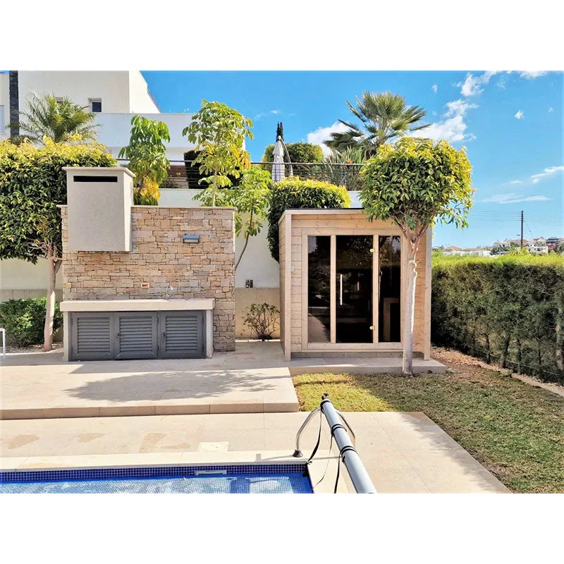 Leil® Patio XS Gartensauna von Leil® Saunas mit Holzfassade im modernen Garten neben Pool