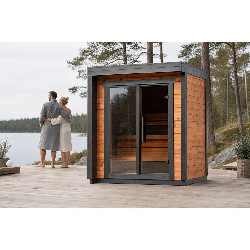 Leil® Patio XXS Gartensauna 3 Personen von Leil® Saunas mit Holzverkleidung am See, Paar in Bademäntel davor