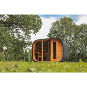 Leil® Round Cube Double Premium Gartensauna 2 Räume mit rundem Design, Holzinnenraum und großen Glasfenstern im grünen Garten