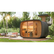 Leil® Round Cube Double Premium Gartensauna 2 Räume mit Holzverkleidung und schwarzem Dach im Garten